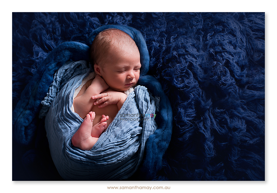 perth newborn baby boy photographed on back 